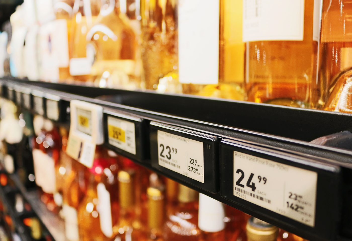 A black Aerofoil blade on a shelf edge, close up, with electronic price labels mounted along its face