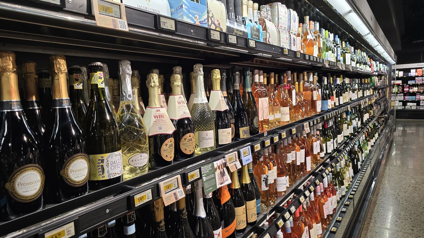 Open refrigerated wine case in a bottle shop